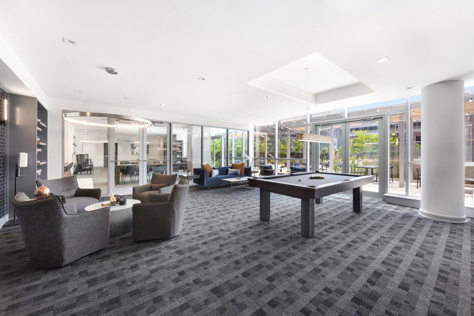 A stylish recreation lounge with a billiards table and contemporary finishes—perfect for unwinding or hosting friendly competition.