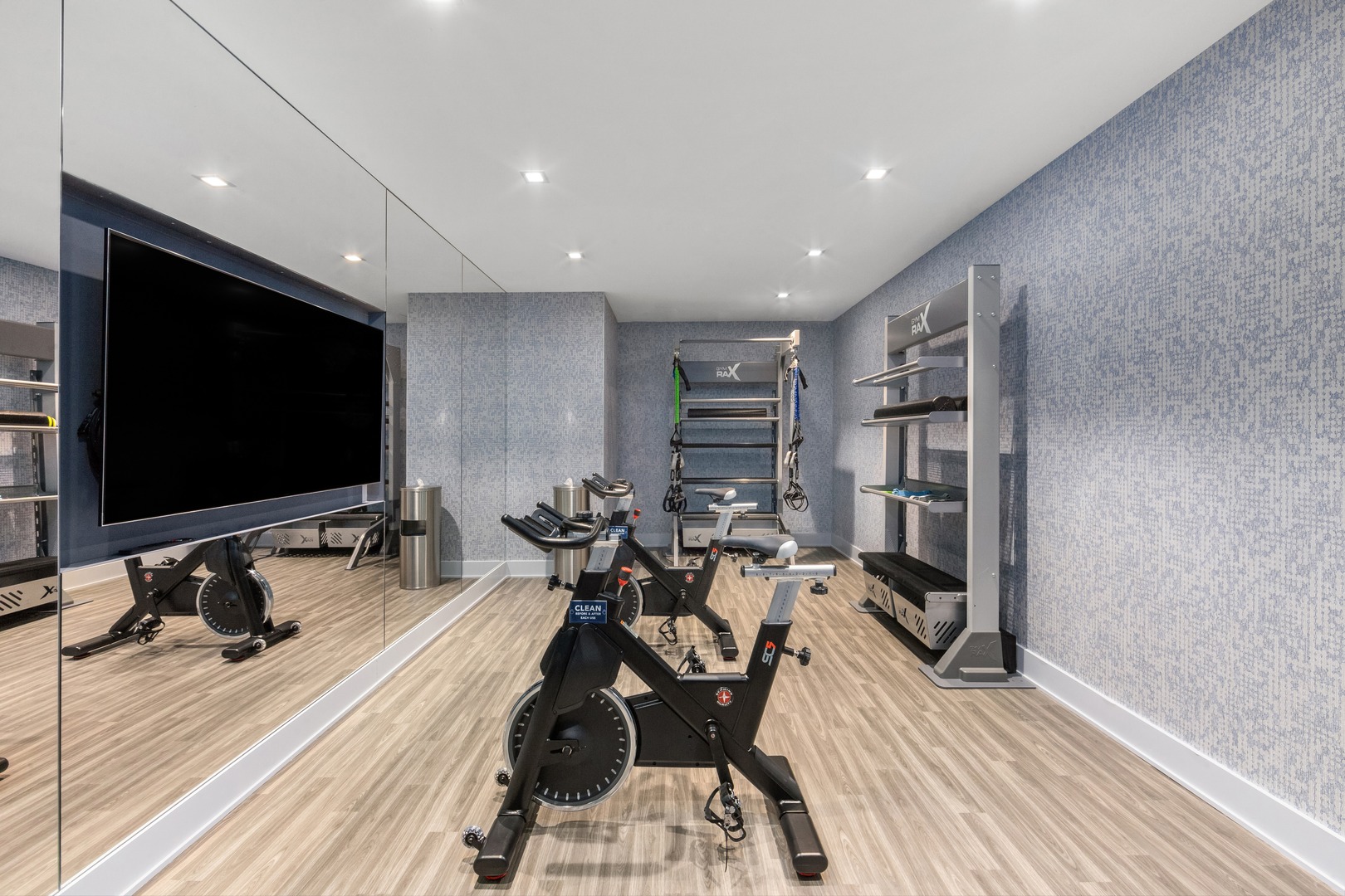 A dedicated wellness space equipped with Peloton bikes and ample natural light, designed to inspire focus, energy, and motivation.